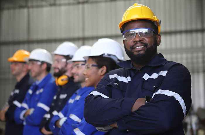 A team of fleet drivers stands and prepares to drive their route.