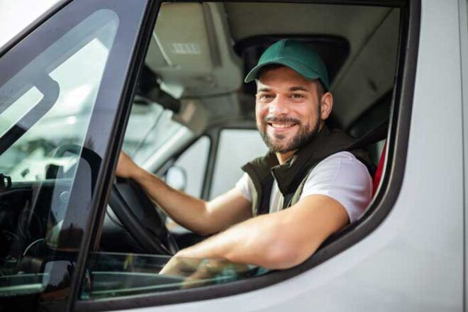 A happy truck driver for a small business fleet.